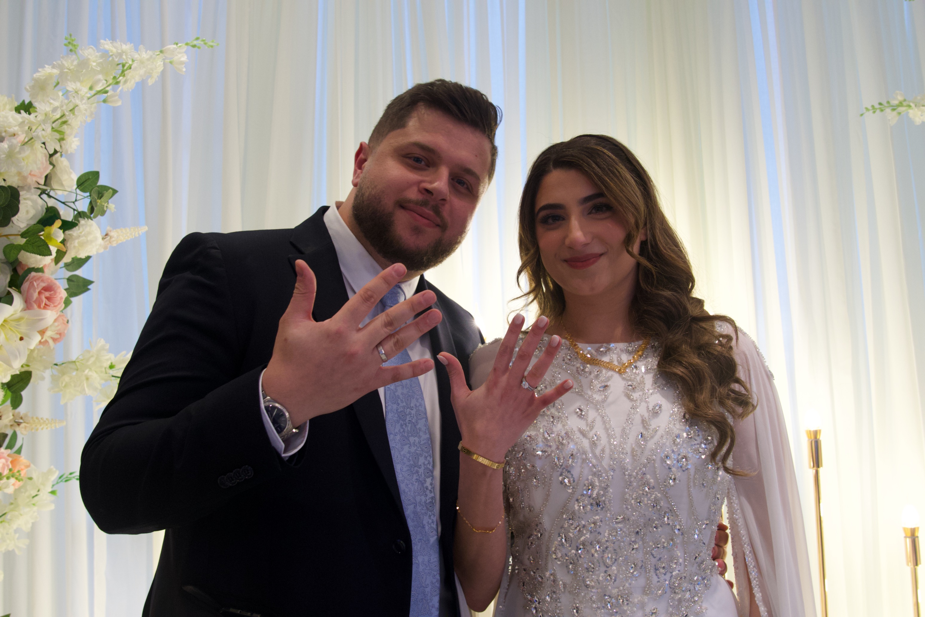 Jamil and Farah showing their rings